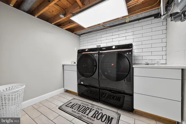 a view of a utility room with wooden floor