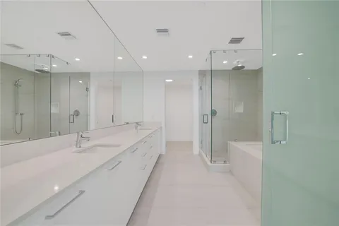 a view of a double vanity sink mirror and