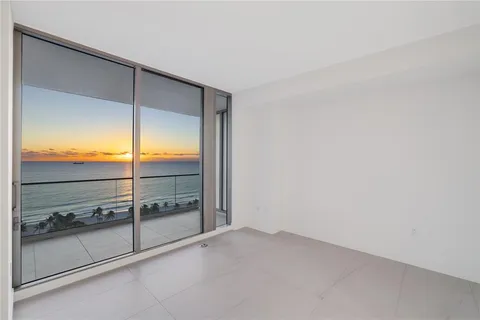 a bathroom with a shower a toilet and sink
