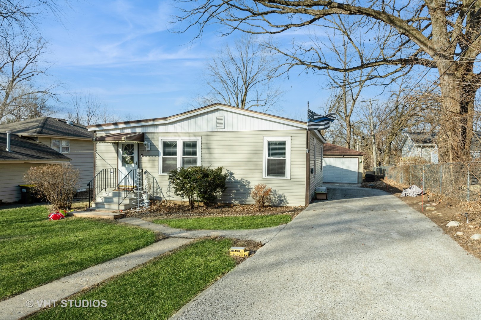 117 Deerpath Road Lake In The Hills, IL 60156 - Photo 1 of 18 a front view of a house with garage and yard
