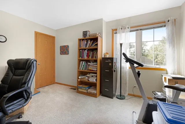 a view of a hallway with windows