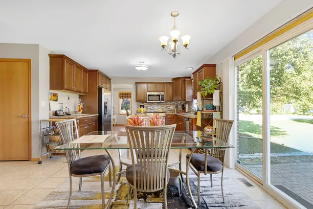 a view of a dining room with furniture window and outside view