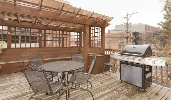 3529 North Reta Avenue, Unit 3R Chicago, IL 60657 - Photo 13 of 14 a kitchen with a table chairs and a stove