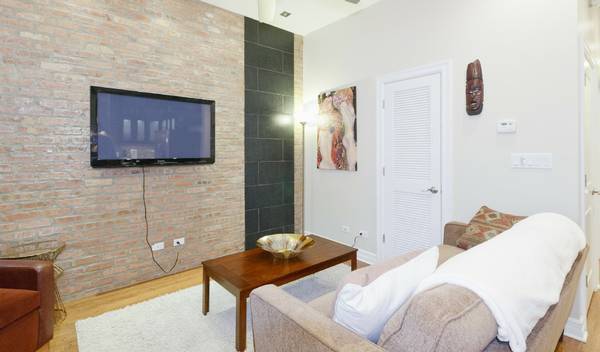 3529 North Reta Avenue, Unit 3R Chicago, IL 60657 - Photo 7 of 14 a bedroom with a bed and furniture