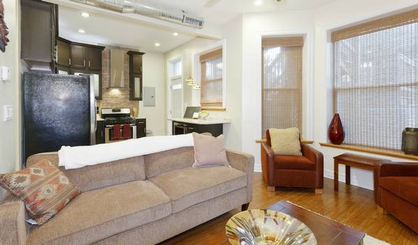 3529 North Reta Avenue, Unit 3R Chicago, IL 60657 - Photo 8 of 14 a living room with furniture and a fireplace