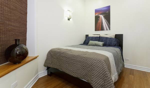 3529 North Reta Avenue, Unit 3R Chicago, IL 60657 - Photo 9 of 14 a bedroom with a bed and walk in closet