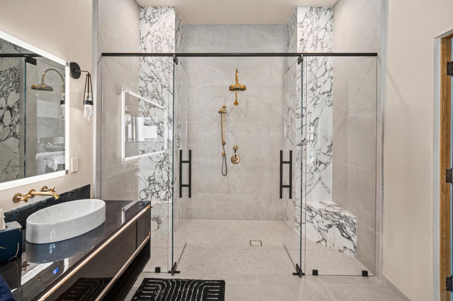 520 Lighthouse Avenue, Unit 301 Pacific Grove, CA 93950 - Photo 11 of 23 a bathroom with a granite countertop shower a sink and a mirror