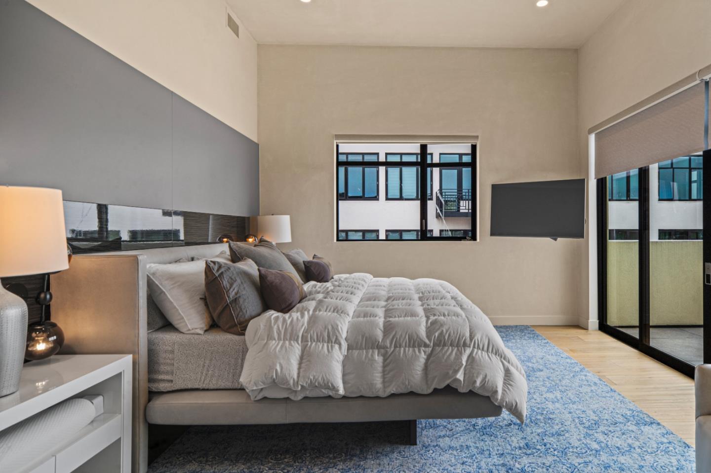 520 Lighthouse Avenue, Unit 301 Pacific Grove, CA 93950 - Photo 12 of 23 a bedroom with two beds and glass window