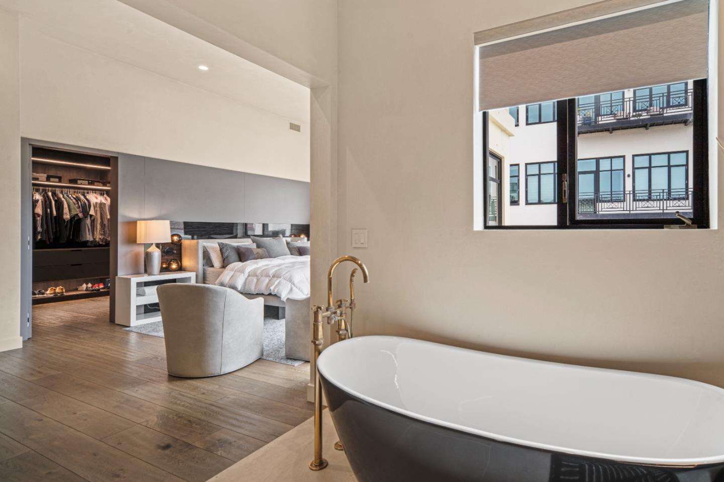 520 Lighthouse Avenue, Unit 301 Pacific Grove, CA 93950 - Photo 14 of 23 a white bath tub sitting in a bathroom next to a small yard