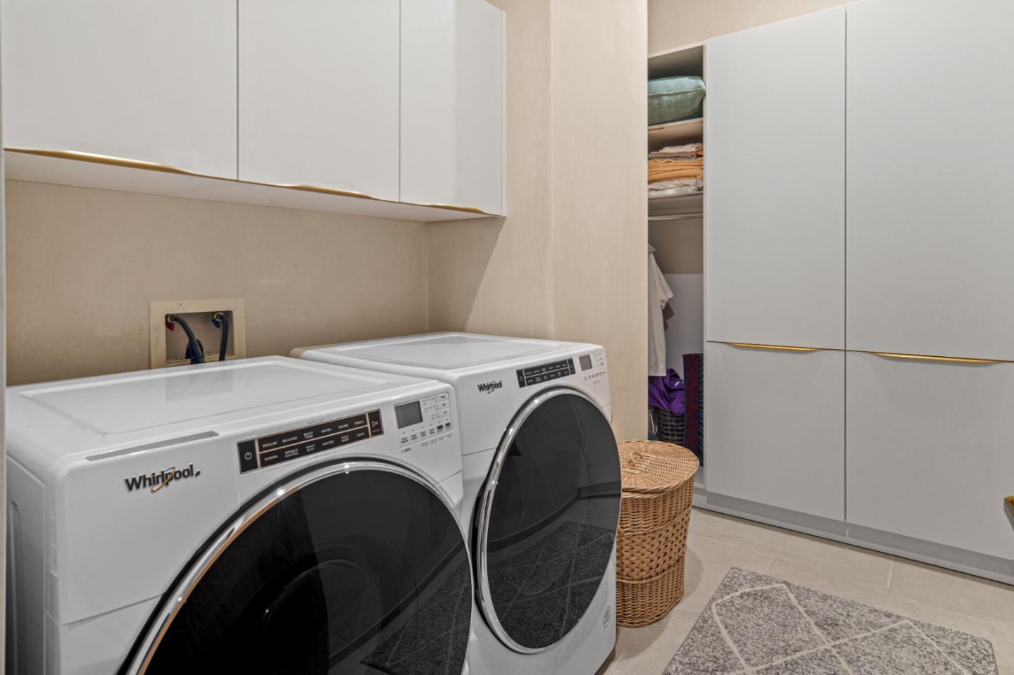 520 Lighthouse Avenue, Unit 301 Pacific Grove, CA 93950 - Photo 21 of 23 a utility room with dryer and washer