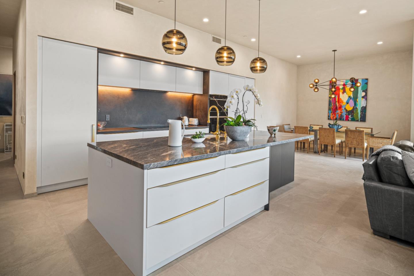 520 Lighthouse Avenue, Unit 301 Pacific Grove, CA 93950 - Photo 6 of 23 a kitchen with stainless steel appliances granite countertop a sink and a refrigerator