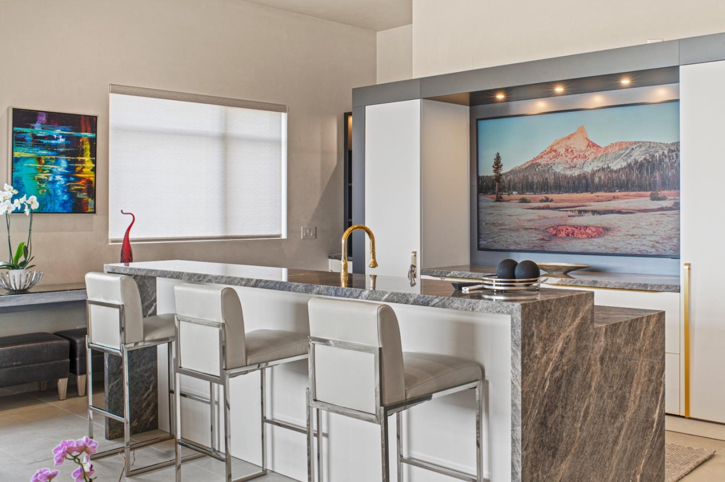 520 Lighthouse Avenue, Unit 301 Pacific Grove, CA 93950 - Photo 9 of 23 a kitchen with stainless steel appliances kitchen island a table and chairs in it