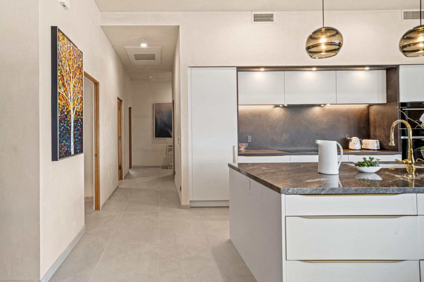 520 Lighthouse Avenue, Unit 301 Pacific Grove, CA 93950 - Photo 10 of 23 a kitchen with a refrigerator and a sink