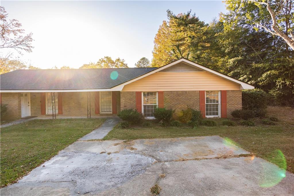 168 Manning Road Southwest Marietta, GA 30064 - Photo 1 of 1 a front view of a house with a yard and garage