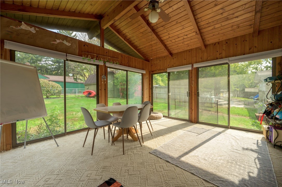 1177 Munroe Falls Kent Road Kent, OH 44240 - Photo 30 of 47 Four-season room with ceiling fan, a wealth of natural light, wood ceiling, and vaulted ceiling with beams