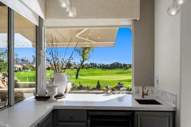 a kitchen with a sink and stove