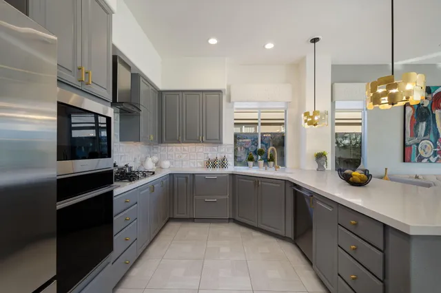 a kitchen with a refrigerator and a sink