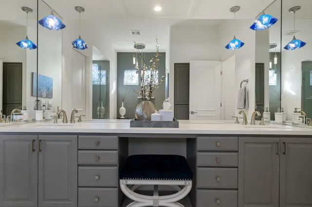 a white tub sitting next to a bathroom