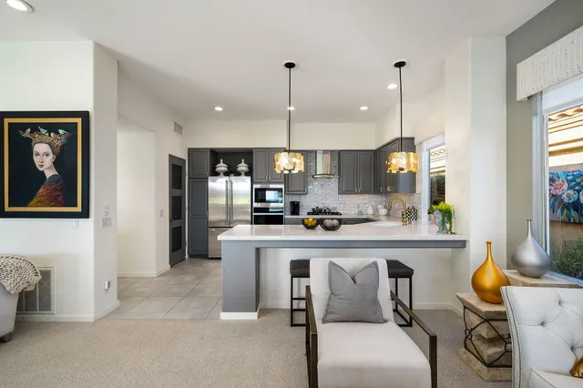 a bathroom with a sink mirror and vanity