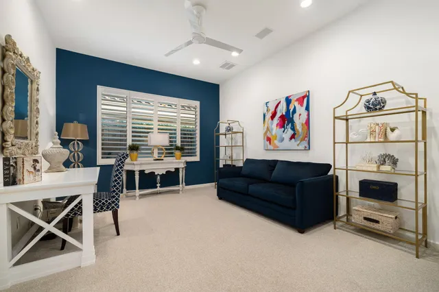 a bathroom with a double vanity sink mirror and shower