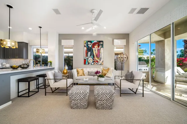 a front view of house with yard and outdoor seating