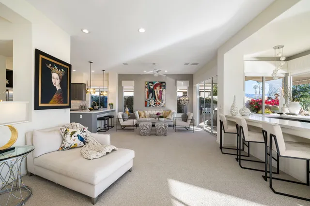 a view of a patio with couches chairs and a yard
