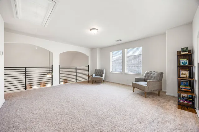 an empty room with furniture and a window