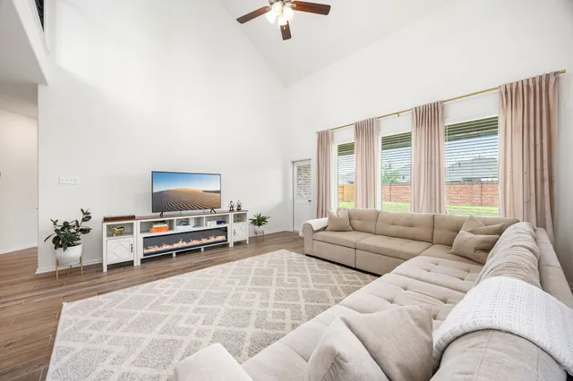 a living room with furniture and a flat screen tv