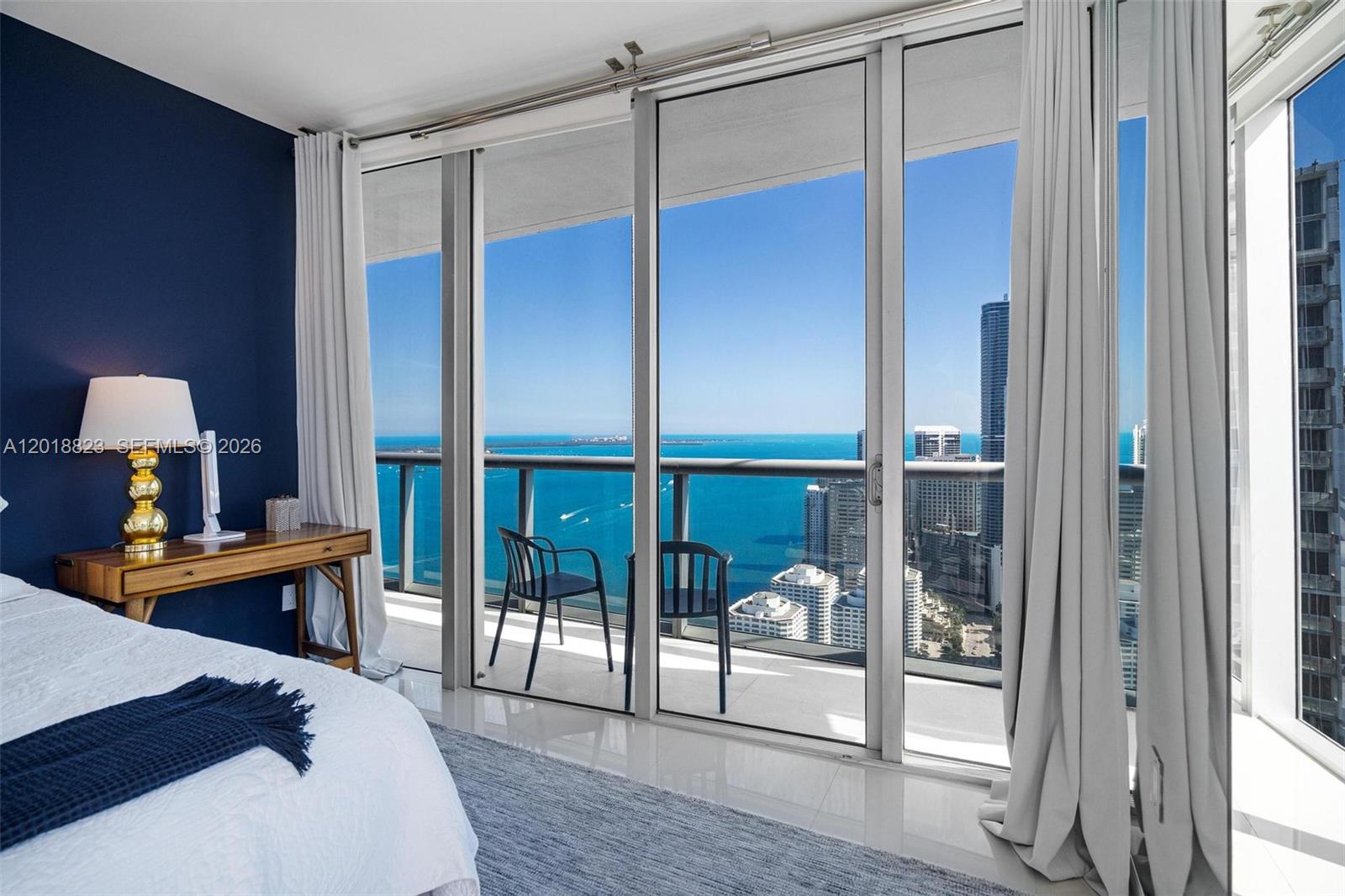 495 Brickell Avenue, Unit 4911 Miami, FL 33131 - Photo 22 of 35 a bedroom with furniture and a window