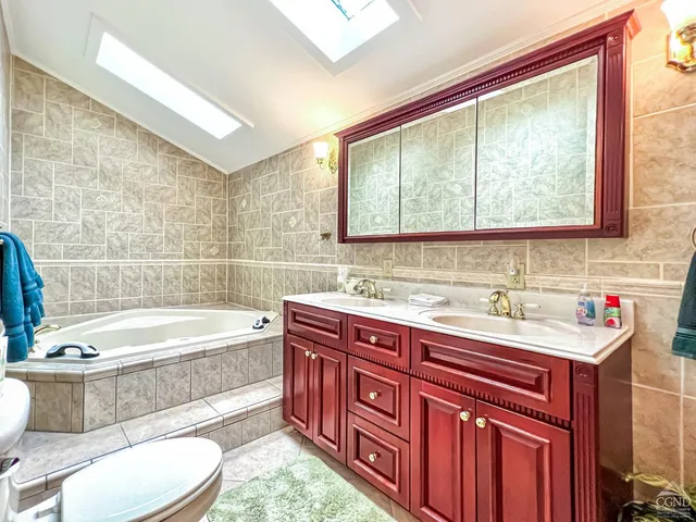 a bathroom with a bathtub sink and toilet
