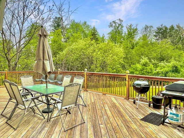a view of a chairs on the roof deck