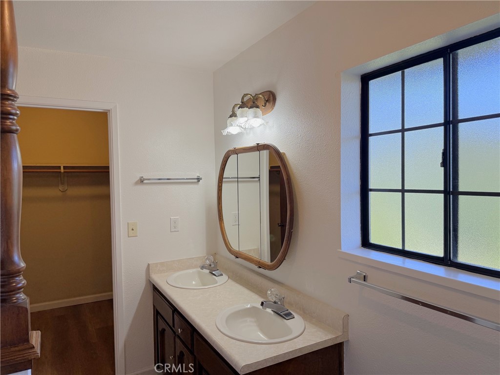 5636 East Whitlock Road Mariposa, CA 95338 - Photo 20 of 41 a bathroom with a sink a mirror and a window