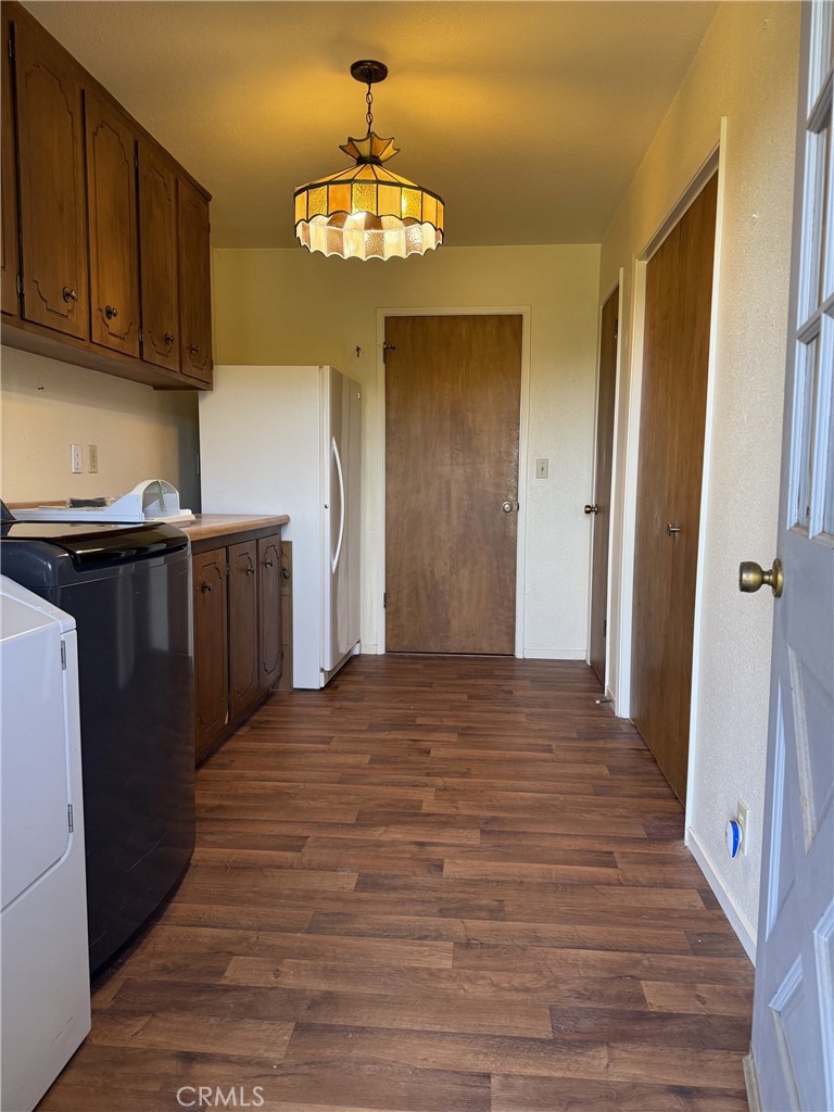 5636 East Whitlock Road Mariposa, CA 95338 - Photo 28 of 41 a view of a kitchen with a sink and wooden floor