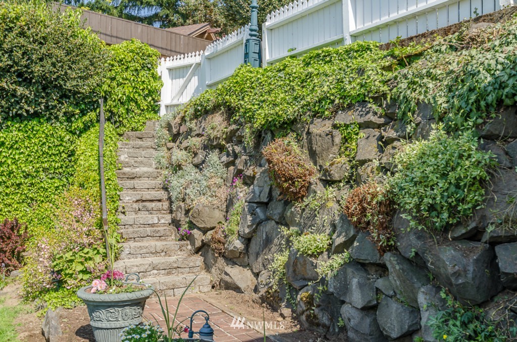 4426 Sunset Beach Road West University Place, WA 98466 - Photo 22 of 25 a view of a backyard with plants