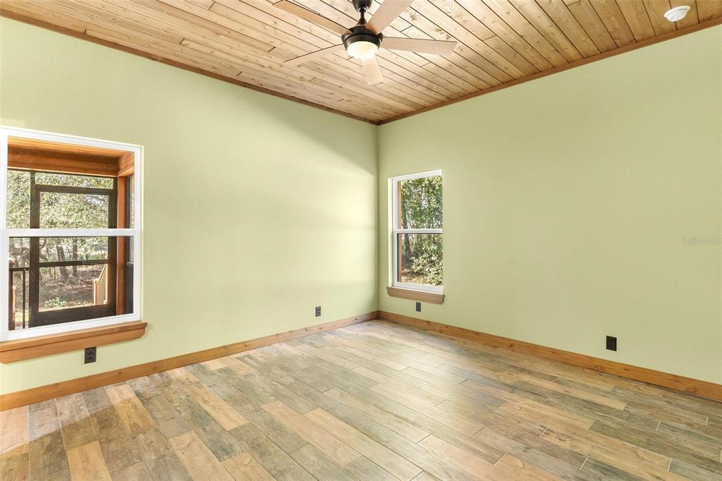 37590 Rolling Acres Road Lady Lake, FL 32159 - Photo 14 of 30 a view of an empty room with a window