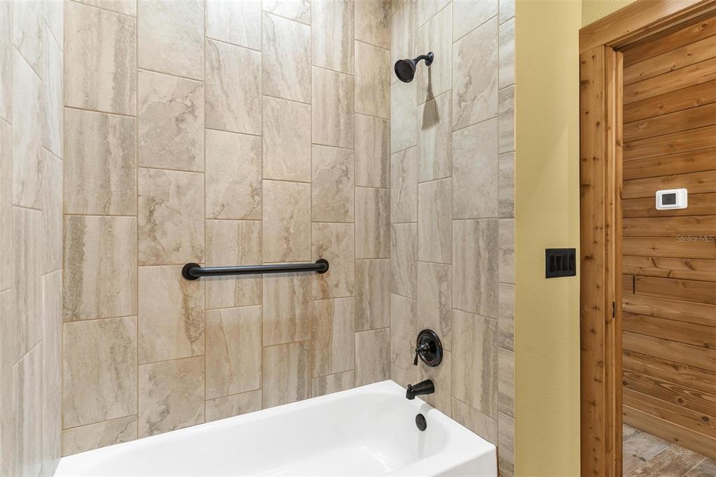 37590 Rolling Acres Road Lady Lake, FL 32159 - Photo 22 of 30 a bathroom with a sink and a shower
