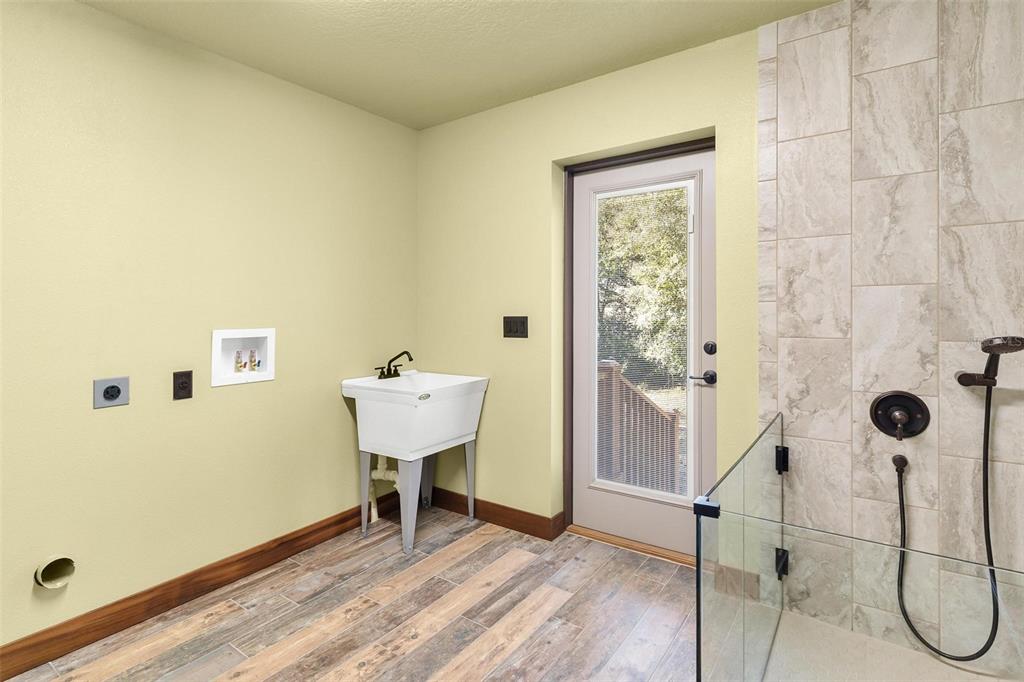 37590 Rolling Acres Road Lady Lake, FL 32159 - Photo 23 of 30 a bathroom with a sink and a shower