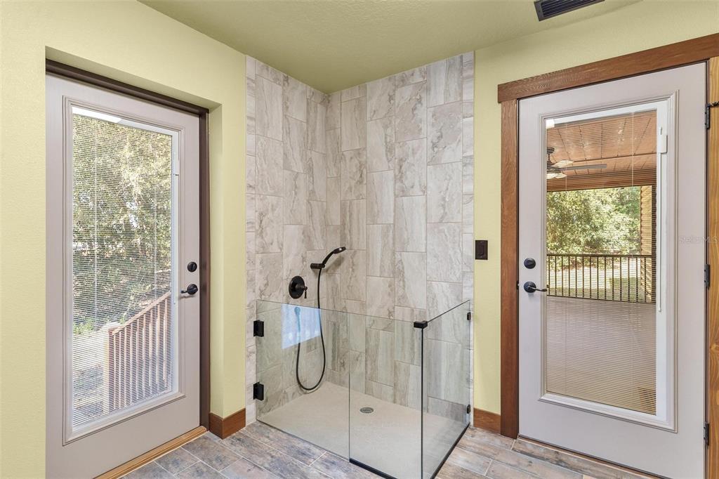 37590 Rolling Acres Road Lady Lake, FL 32159 - Photo 24 of 30 a bathroom with a shower