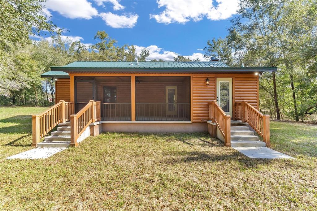 37590 Rolling Acres Road Lady Lake, FL 32159 - Photo 27 of 30 a front view of a house with garden