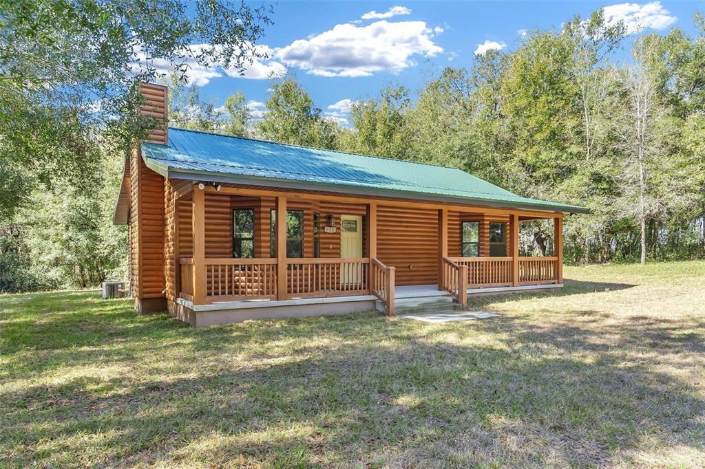 37590 Rolling Acres Road Lady Lake, FL 32159 - Photo 28 of 30 a view of a house with a yard