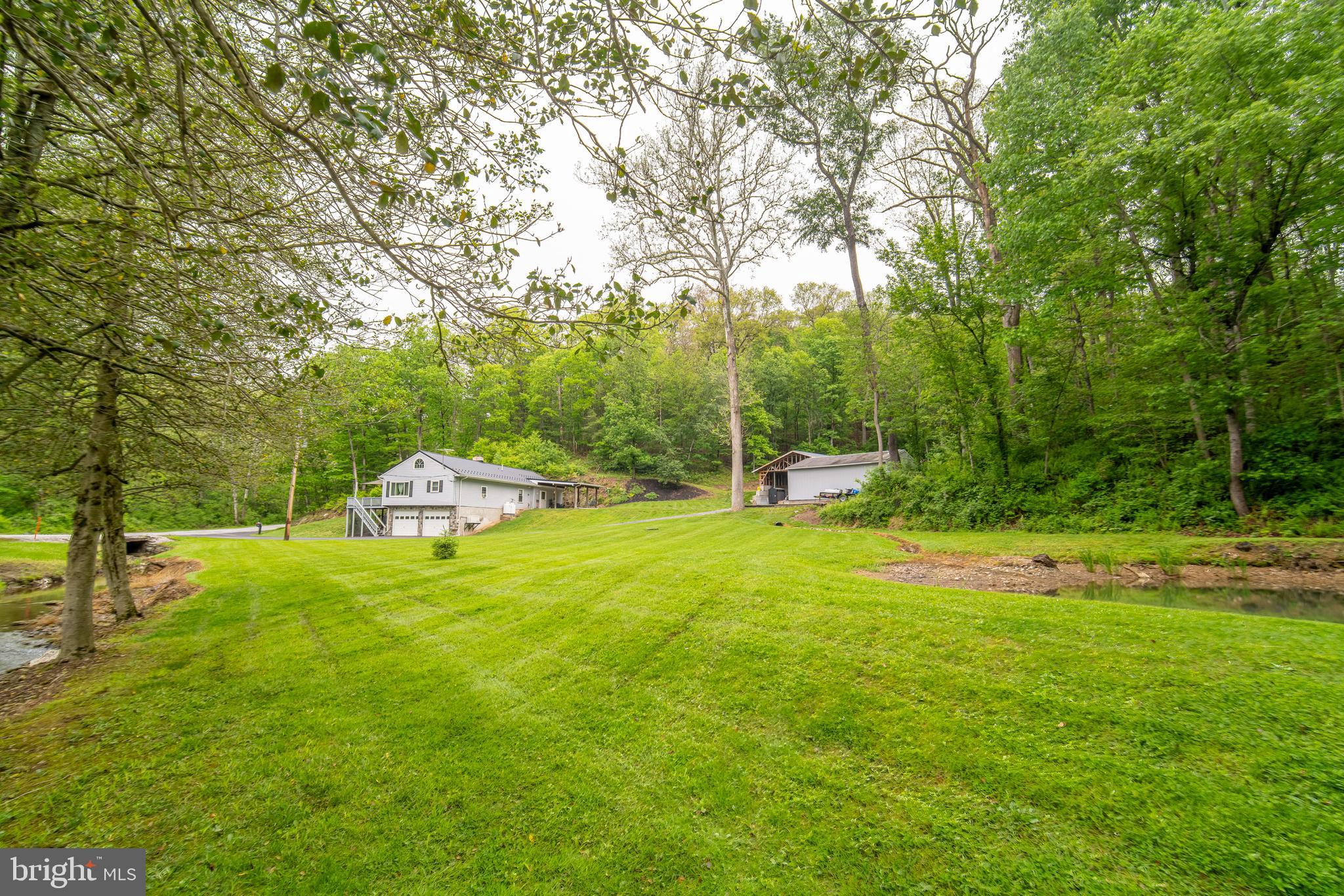 13127 Manor Furnace Road Brogue, PA 17309 - Photo 14 of 78 a backyard of a house with a table and chairs