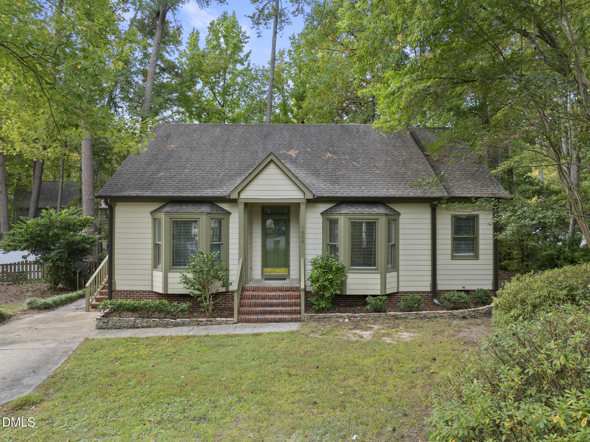 a house view with a garden space