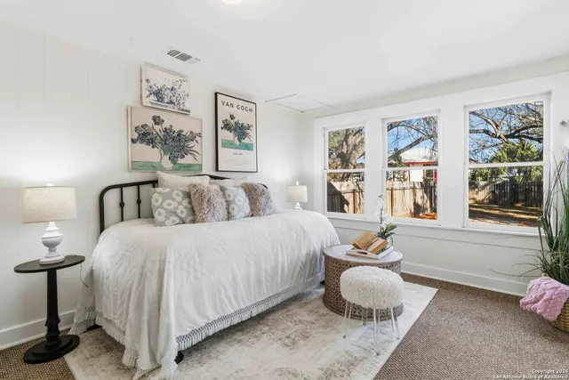 a bedroom with a bed and window