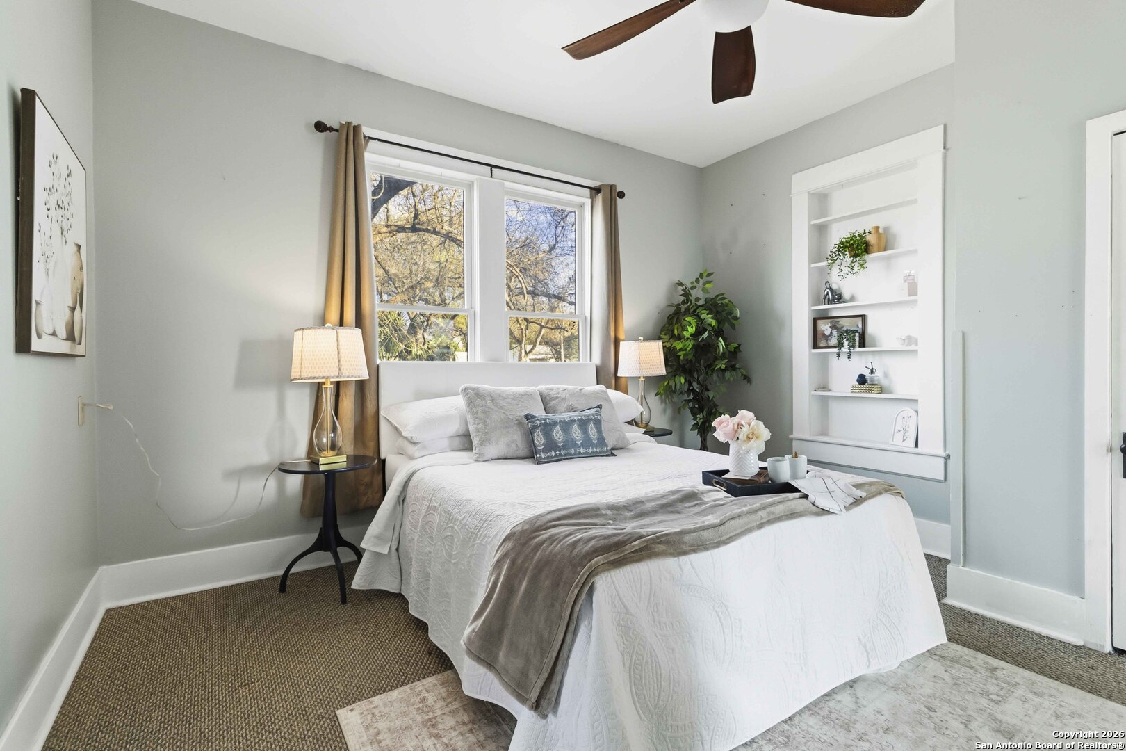 1409 21st Street Hondo, TX 78861 - Photo 18 of 25 a bedroom with a large bed and a window