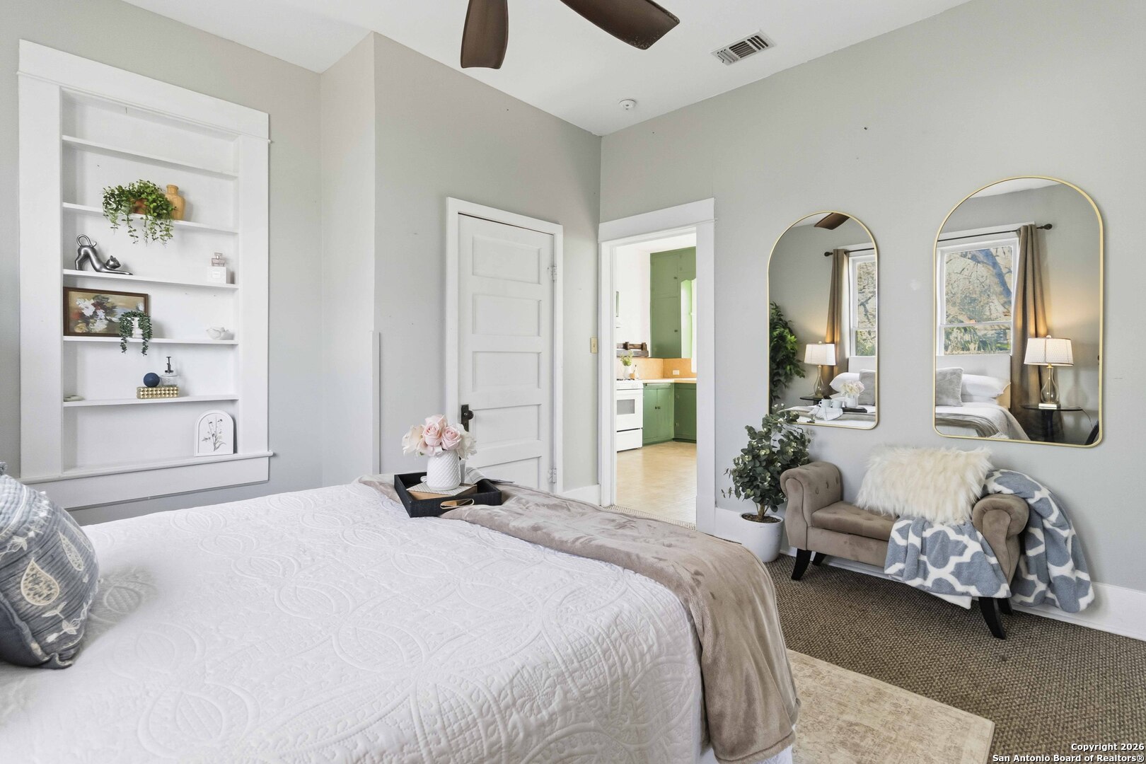 1409 21st Street Hondo, TX 78861 - Photo 19 of 25 a bedroom with a bed and a large mirror