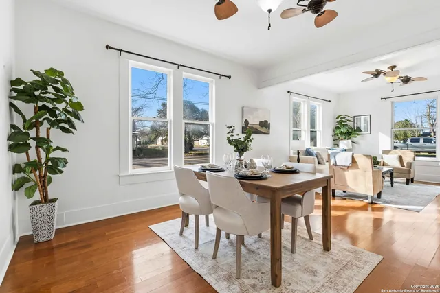 a view of a dining room with furniture window and wooden floor