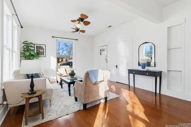 a view of a livingroom with furniture and a a table