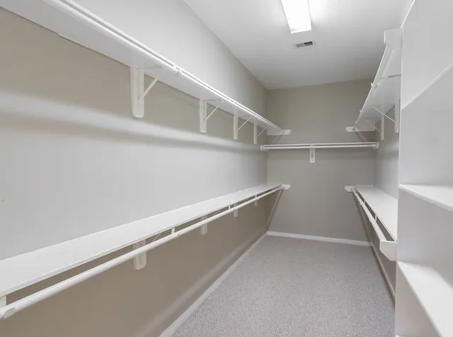 a view of an empty walk in closet