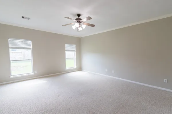a view of an empty room with a window