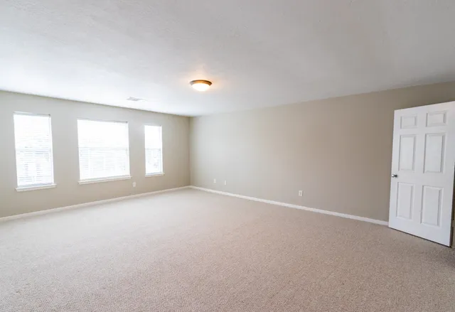 an empty room with windows